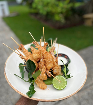 Coconut Crumbed Prawns on Platter with Kaffir Lime Leave and Fruit